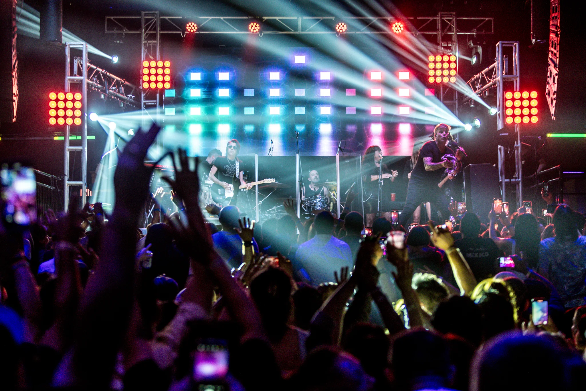Colorful professional lighting across a live event stage